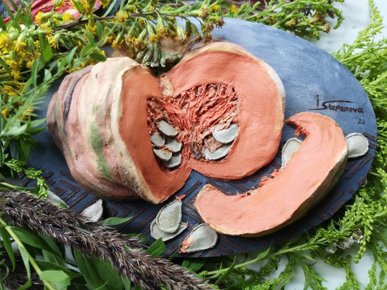 Juicy pumpkin on a dark background-a delicious bas-relief for the kitchen 13,5x20x4 cm.