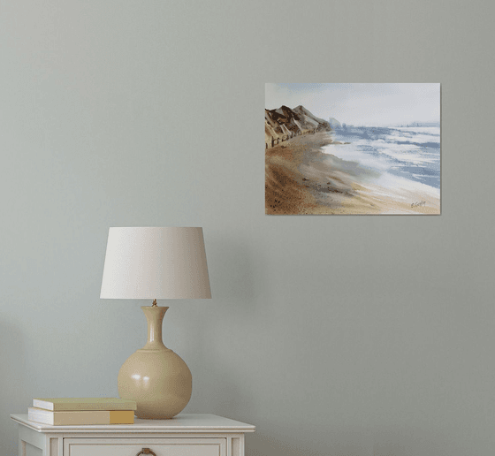 Seascape with beach and mountains