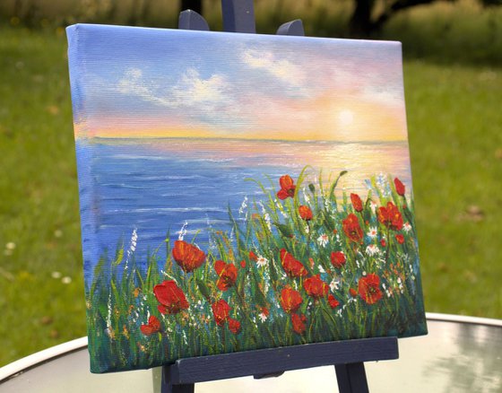 Sunset seascape and poppies