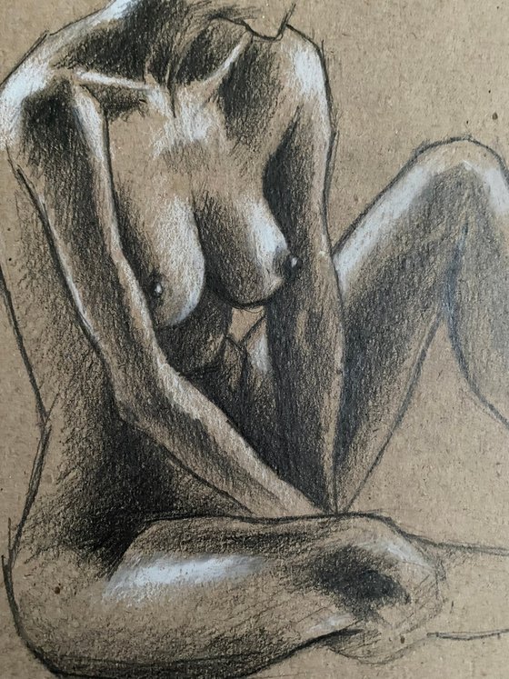 Nude sitting woman