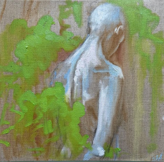 figure with green bushes