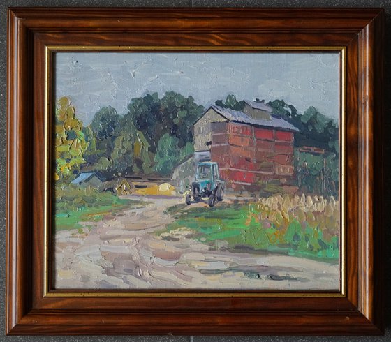 Blue tractor at the sawmill. Rodnya village