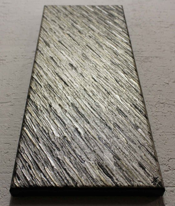 Iridescent grey pewter knife texture