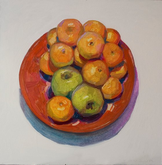 tangerines and apples in a plate