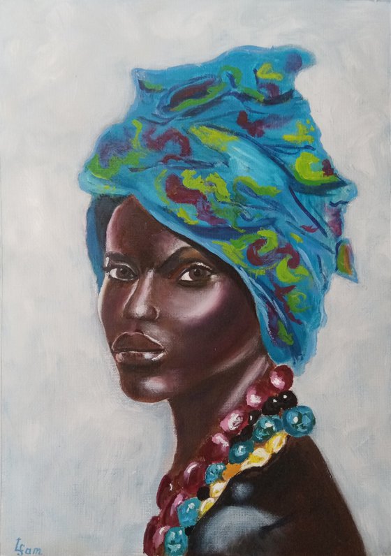 Portrait of a dark-skinned beauty in a turquoise turban