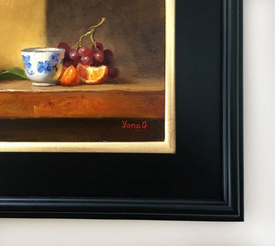 Still life with flower pot, tanderines and grapes. Framed painting. Oil on linen