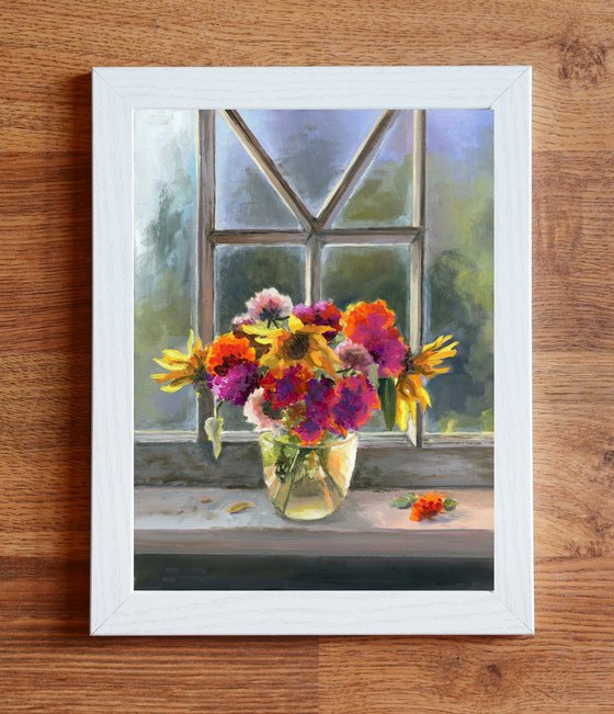 Vase of flowers on a window sill