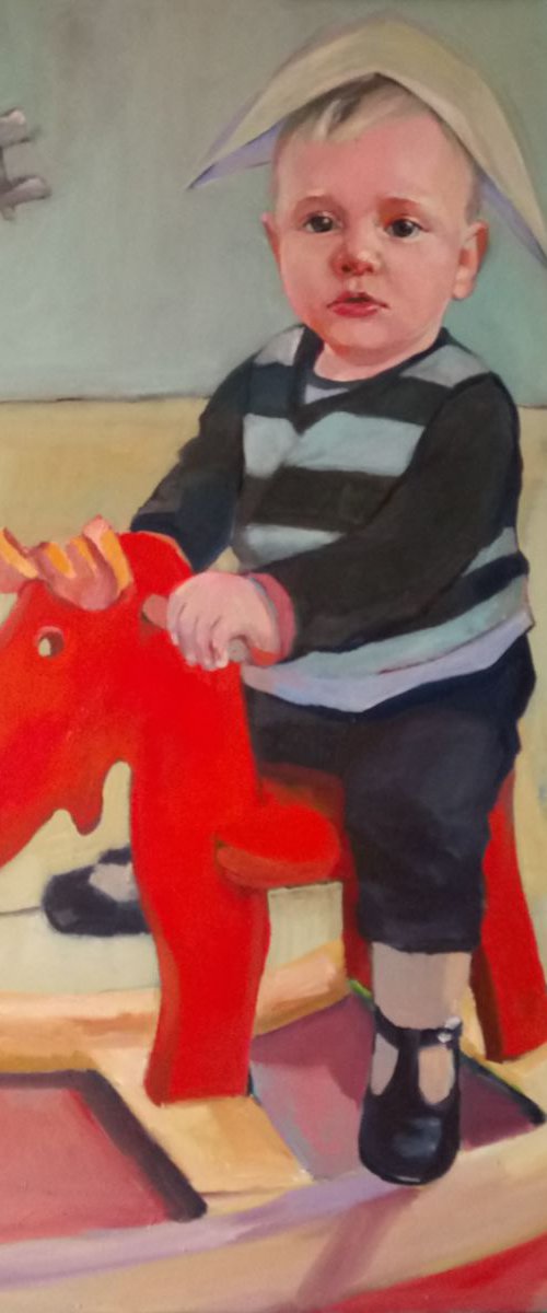 Boy on rocking moose. by Anna  Wojciechowska