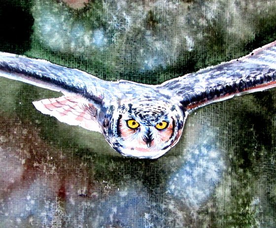 Flying great horned owl