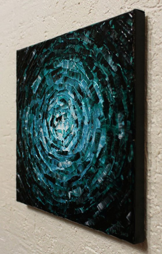 Small shine of iridescent emerald blue glow