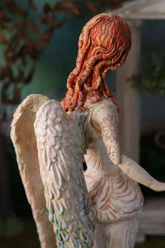 Angel with a tattoo. Ceramic OOAK sculpture.