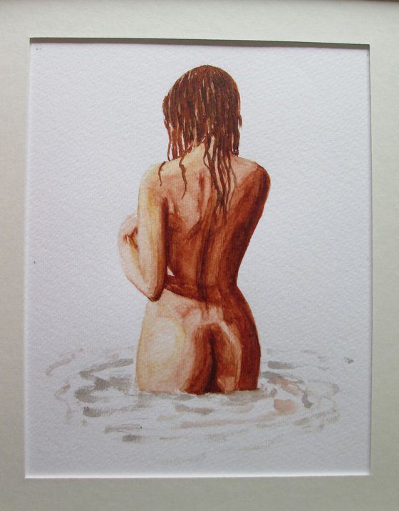 Nude standing in water