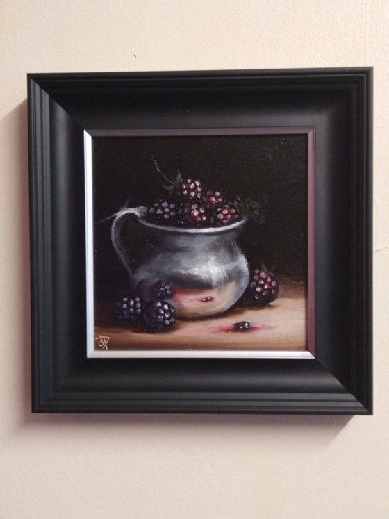 Silver cup with blackberries still life