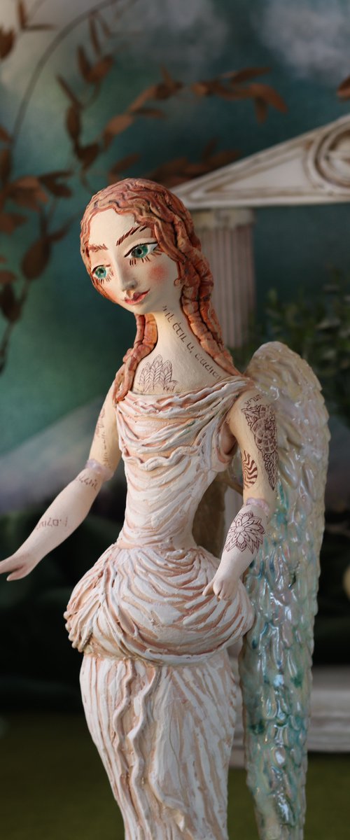 Angel with a tattoo. Ceramic OOAK sculpture. by Elya Yalonetski