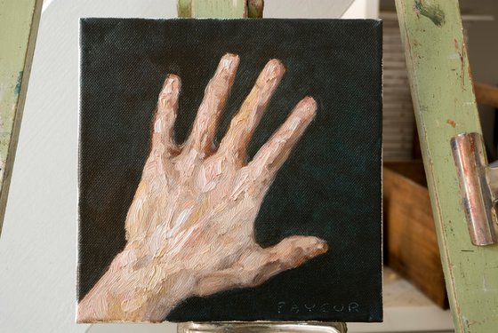 hand on dark backgrounf