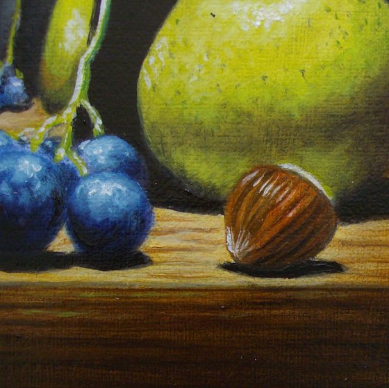 Pear and grape in silver goblet