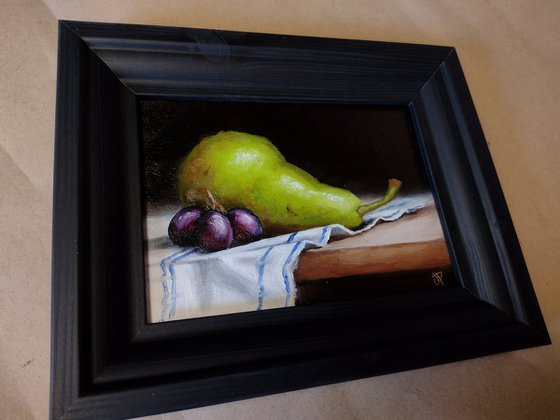 Pear on cloth still life