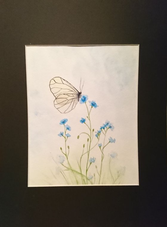 Butterfly and blue flowers
