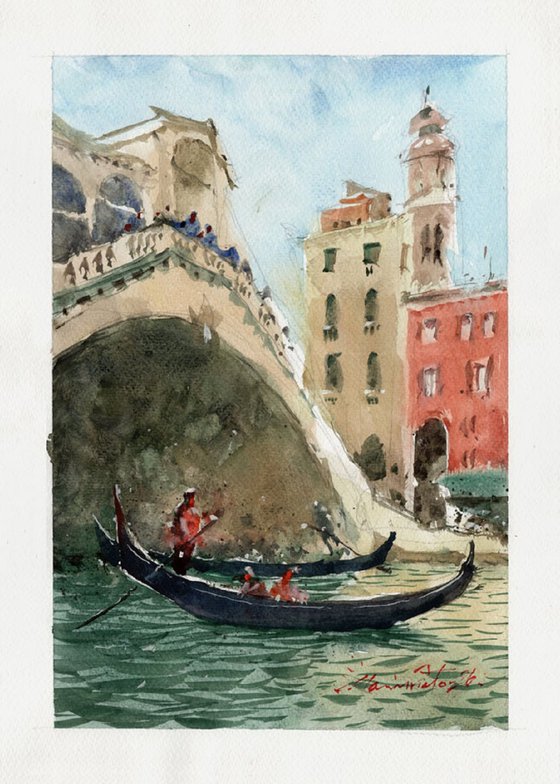 Gondola passes under Rialto Bridge