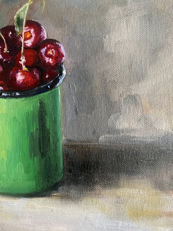 Cherry in a green cup