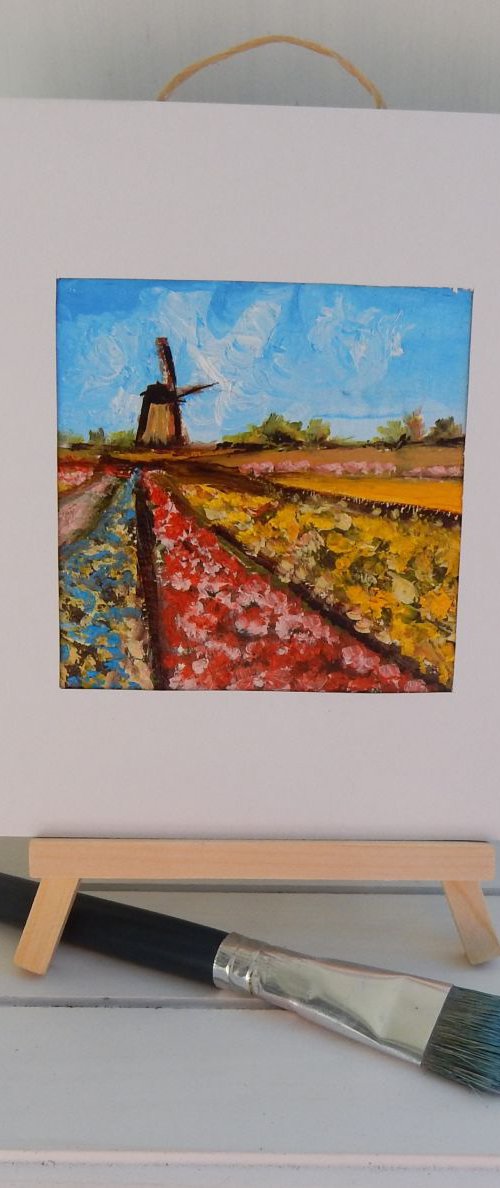 Tulip fields with wild mill in Holland (2). by Vita Schagen