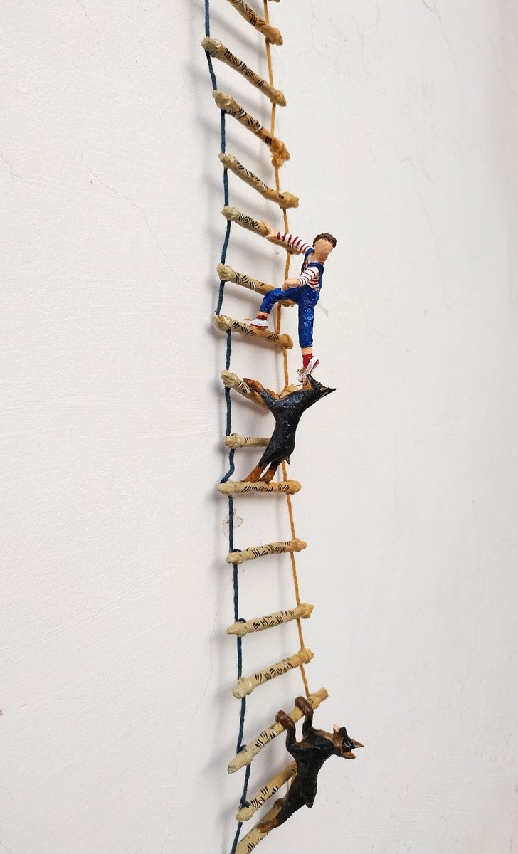 Two Dobermans and the figure on the ladder - one of a kind paper sculpture by Shweta  Mahajan