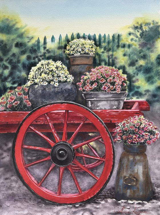 Old red cart with flowers
