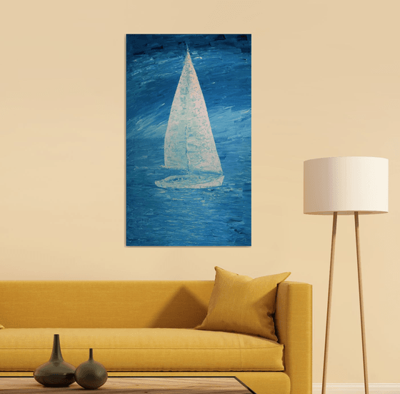 Blue sea and white sailboat