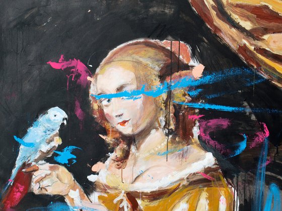Young woman feeding a parrot