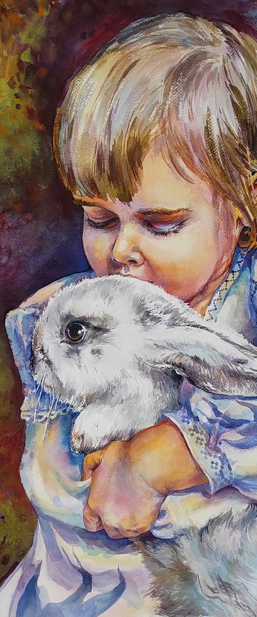 A little girl with a rabbit by Tetiana Borys