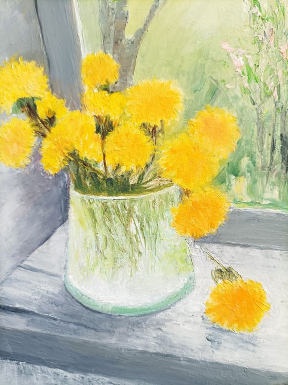 Spring with dandelions at the window