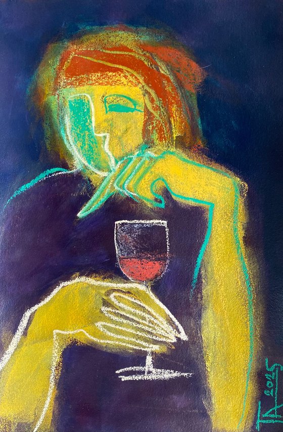 With a glass of red wine.