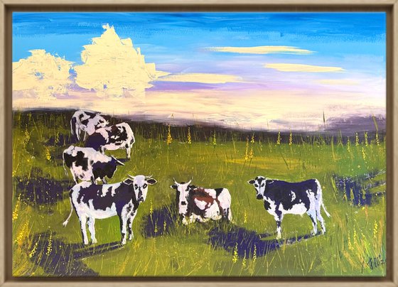 Cows grazing in the field