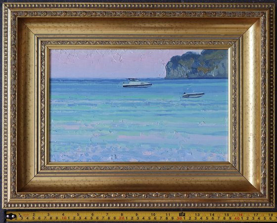 Sunset. Boats on the sea