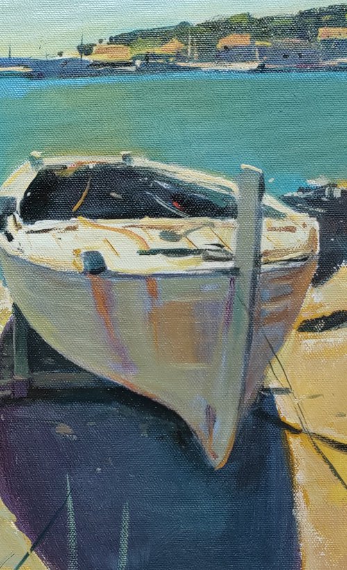 Boat on the sunlit seashore by Róbert Kormos