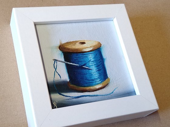 Little blue  cotton reel still life