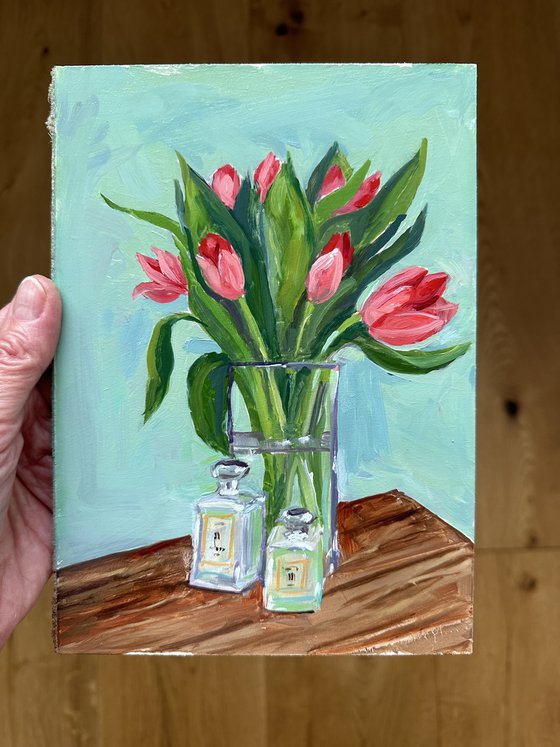 Pink tulips in glass vase
