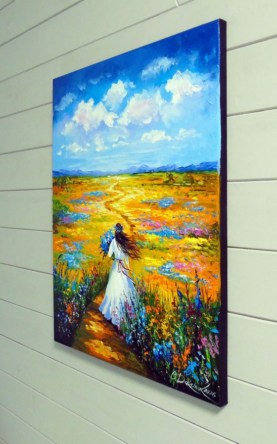 Woman Walking Through a Flower Field