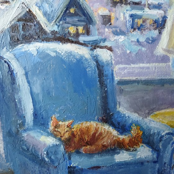 Ginger cat and armchair