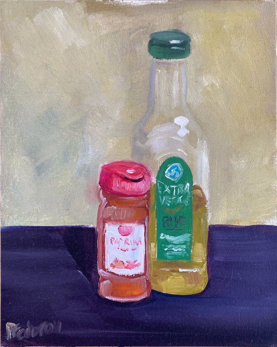 Still life with a bottle of olive oil and paprika