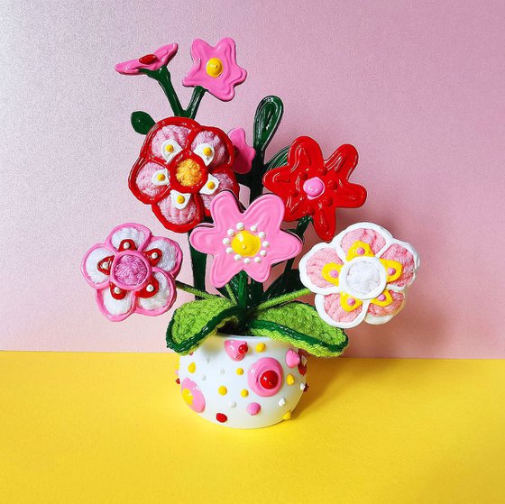 Knitted flowers in vase