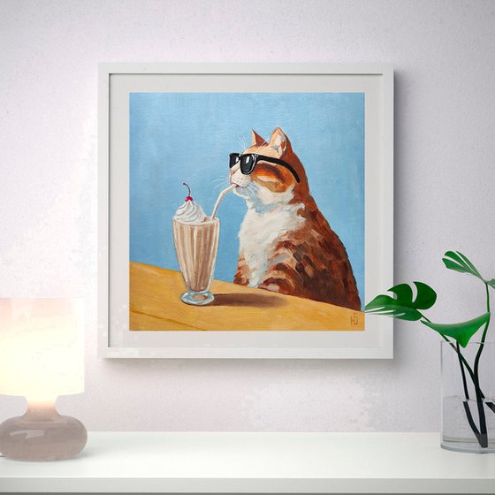 Cat drinking a milkshake