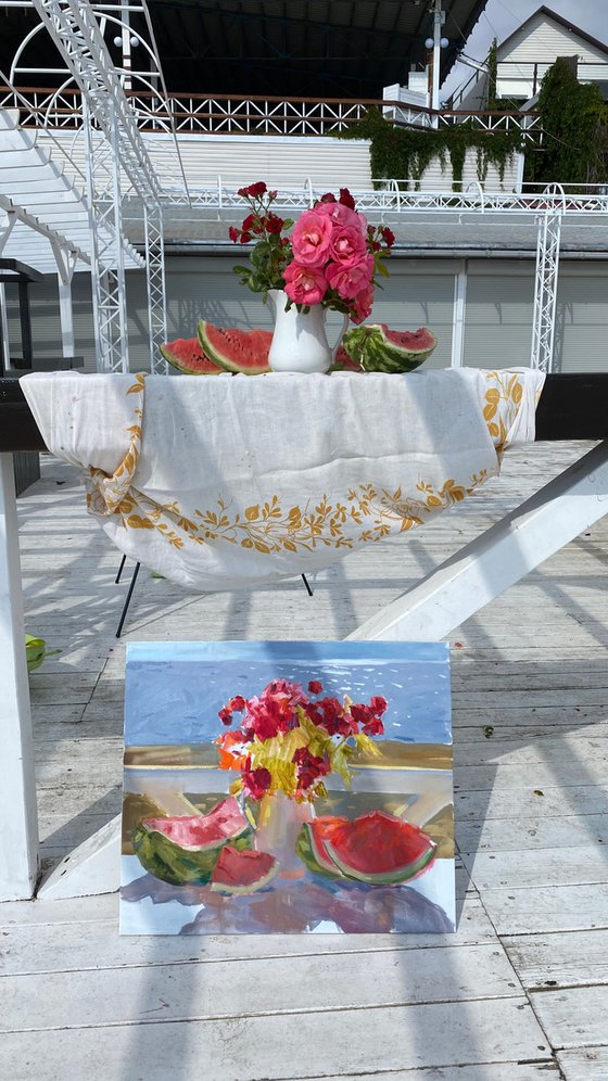 Red roses, watermelon and sea view