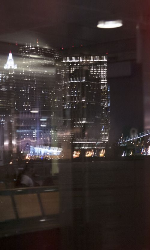 Reflections of Manhattan at night by Louise O'Gorman