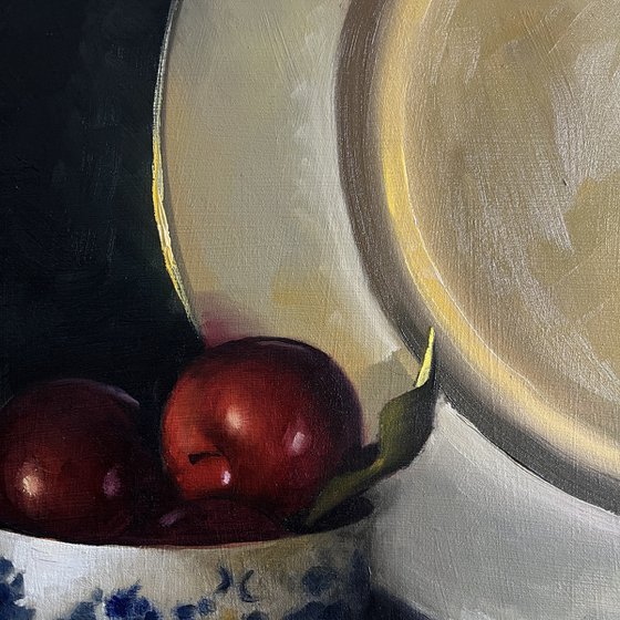 Plums and gold plate.