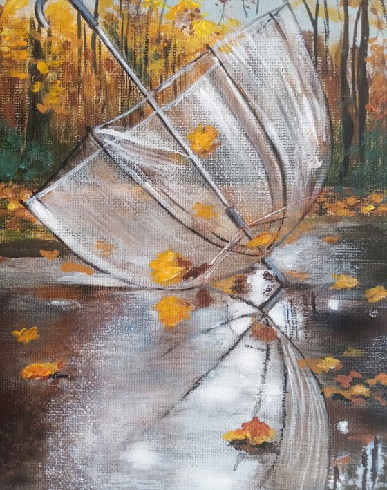 A forgotten umbrella in autumn