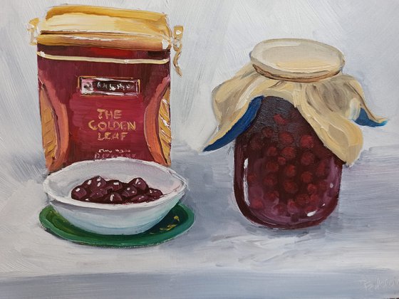 Still life with the cherry jam and the tea box