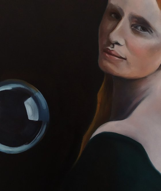 Portrait of a woman with the suspended sphere