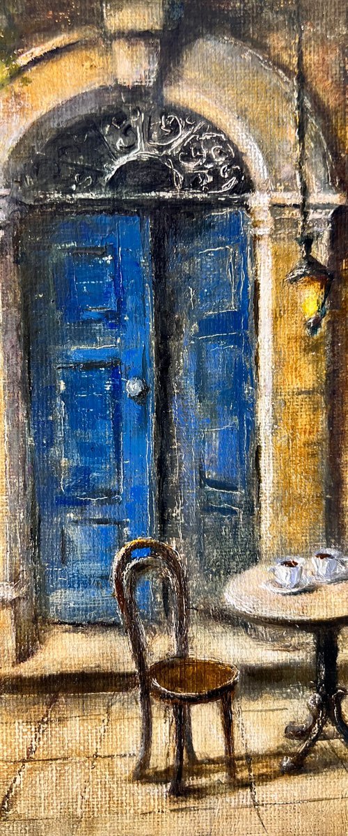 Old Blue Door of a Cozy Café by Yulia Odukalets