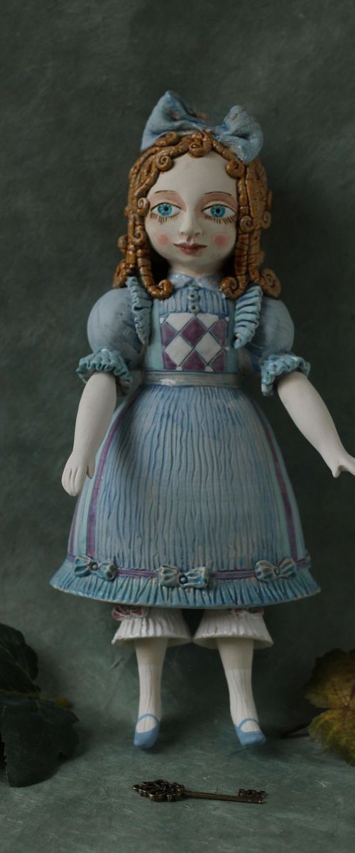 From the Alice in Wonderland. Alice as a little girl.  Wall sculpture by Elya Yalonetski by Elya Yalonetski